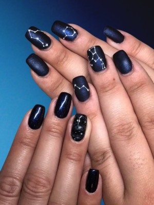 Dark blue nails with constellation art