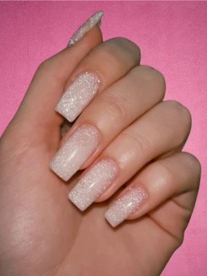 Milky white and pink glitter nails