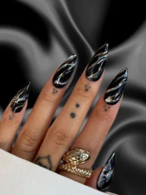 Sophisticated Black French Tips with Metallic Charm